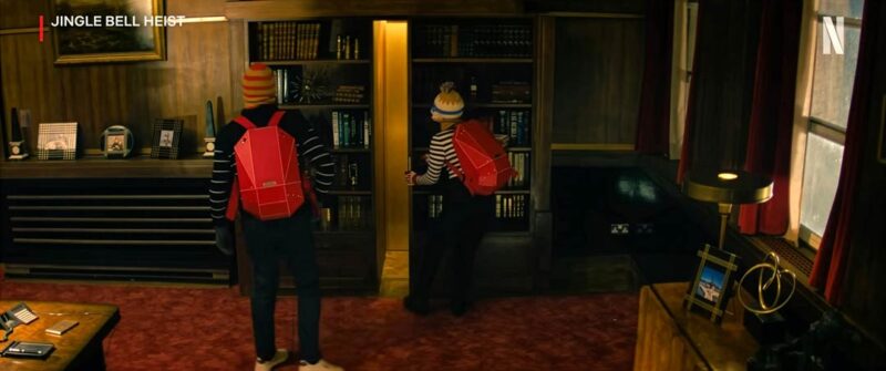 Film still from Netflix’s Jingle Bell Heist featuring the red Jingle Bell Heist backpack by SOLID GRAY