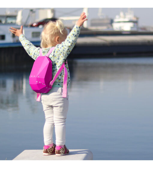 A pink hard shell backpack with a minimalist design by solid gray